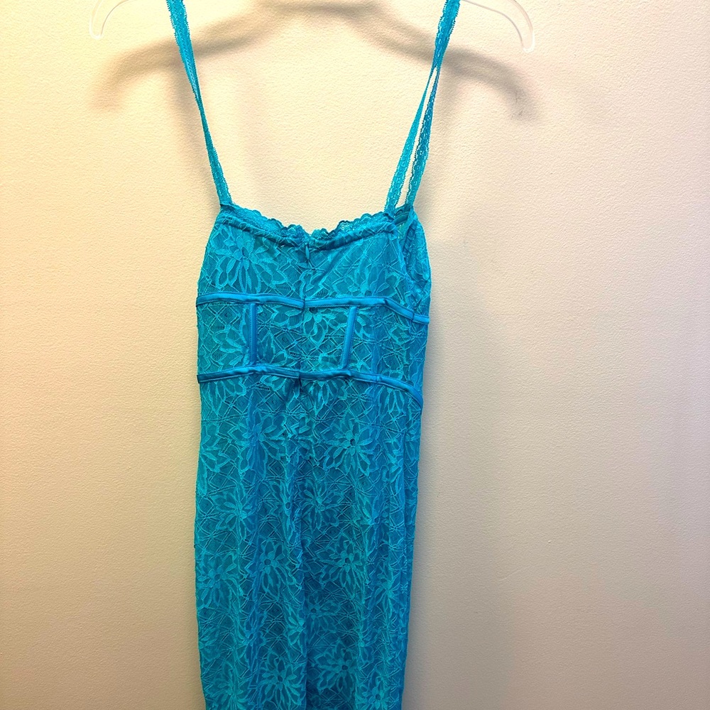 Never worn Meshki turquoise sexy dress! Inside is a bodysuit with lace over top.